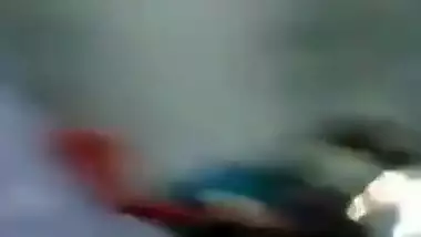 Young village girl taking carrot