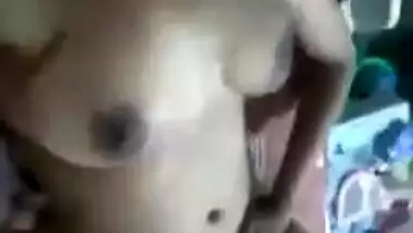 Naked Desi chick seductively plays with perky XXX boobs on camera